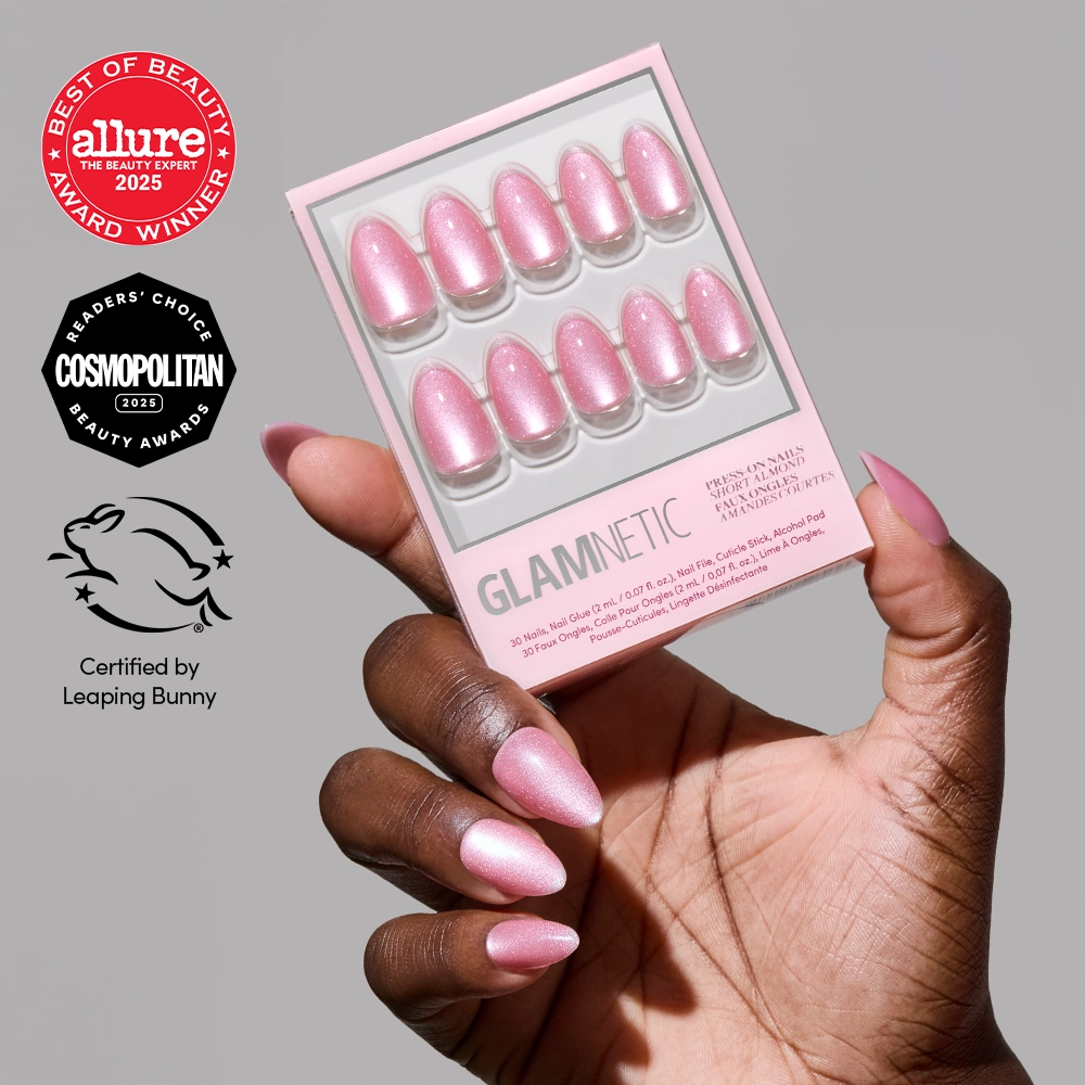 A hand with rosy pink velvet nails in a short almond shape holds the glamnetic Shine for You set. Award badges from Allure and Cosmopolitan, plus Leaping Bunny certification logos, appear on the left side of the image. - Product image