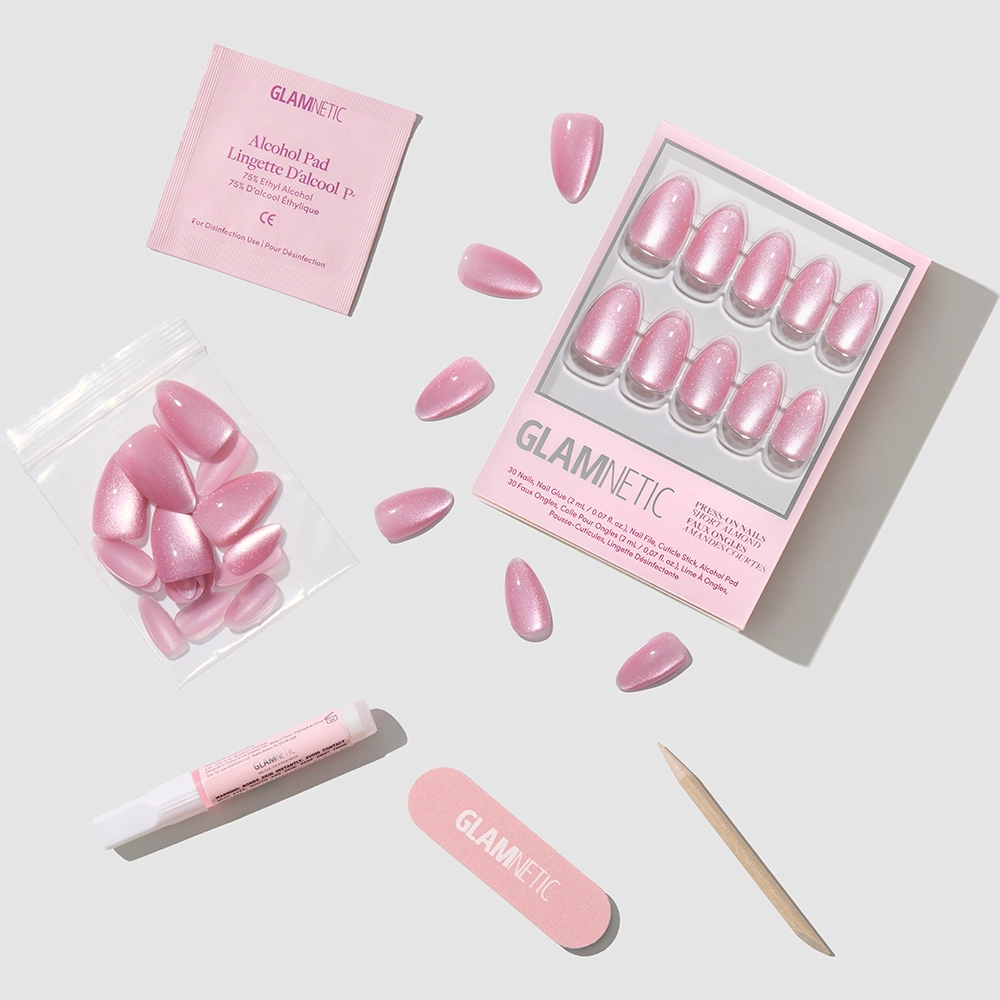 The glamnetic Shine for You nail set includes short almond rosy pink velvet nails, a nail file, cuticle stick, glue tube, alcohol pad, and extra nails—displayed neatly on a white background. - Product image