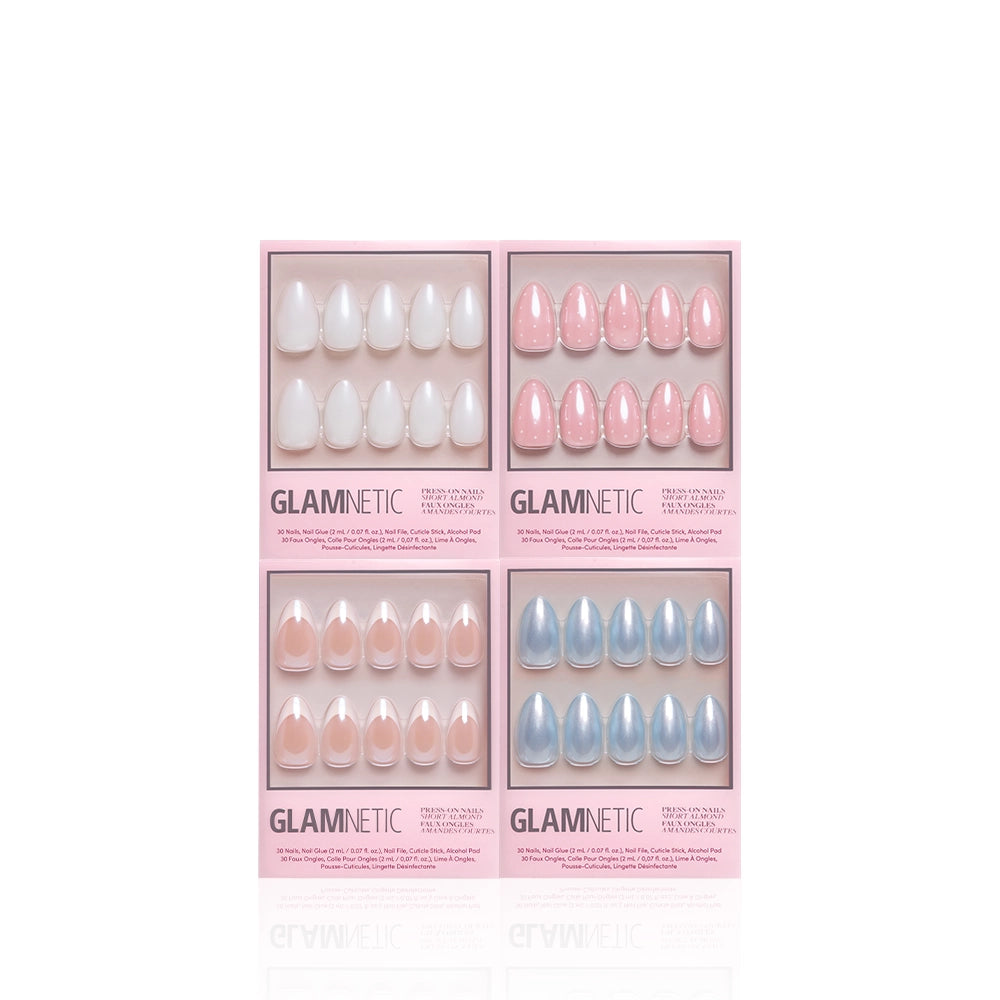 Four boxes of glamnetic Short Almond Syllabus press-on nails in various pastel shades (white, light pink, pink, and blue) arranged in a grid on a white background. Each box features salon-quality press-on nails for an effortless, polished look. - Product image