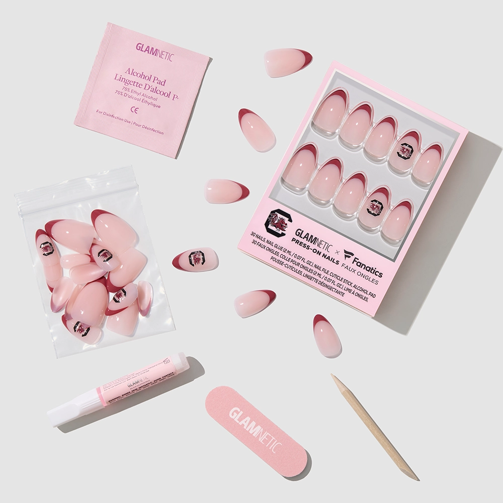 The glamnetic South Carolina Gamecocks Press-On Nail Set includes pink almond-shaped press-ons, a box, glue, cuticle stick, nail file, alcohol pad & extra nails—perfect for showing off Gamecocks style at home. - Product image