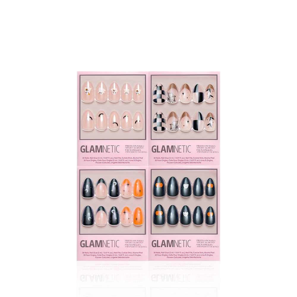 Four boxes of glamnetic’s Spellbook Classics press-on nails are displayed, each featuring a unique almond-shaped design in an array of black, nude, orange, and silver hues and patterns against a white background. This festive Halloween set from glamnetic delivers bold styles that are perfect for the season. - Product image