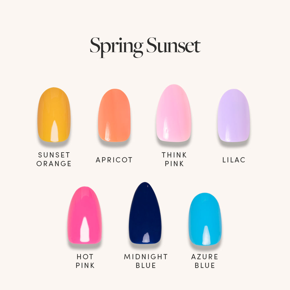 The glamnetic Spring Sunset set features seven glossy oval press-on nails in sunset orange, apricot, think pink, lilac, hot pink, midnight blue, and azure blue on a light background with Spring Sunset written above. - Product image