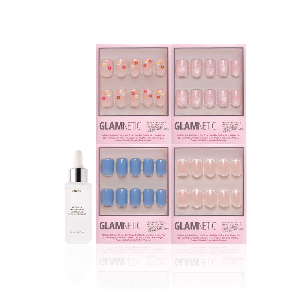 A bottle of glamnetic cuticle oil with dropper sits beside four Springtime Squovals press-on nail sets in pink packaging—featuring floral, glittery pink, matte blue, and solid nude designs for salon-quality spring nails. - Product image
