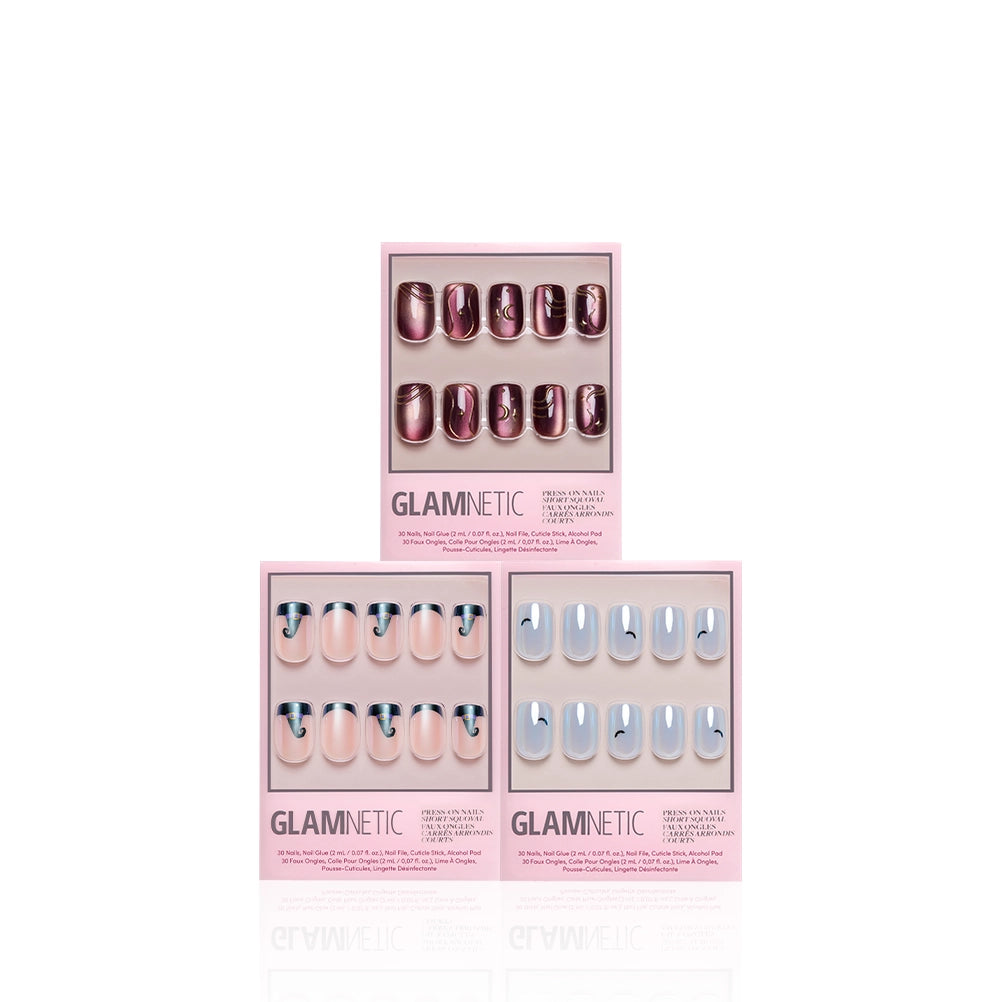 Discover the Squoval Spellbook by Glamnetic: this set of three press-on nail kits features salon-quality, short squoval nails. The top kit showcases metallic burgundy nails with sophisticated gold line art. On the bottom left, you’ll find nude short squoval nails highlighted by modern dark blue tips, while the bottom right includes light blue nails detailed with subtle dark swoosh accents. - Product image