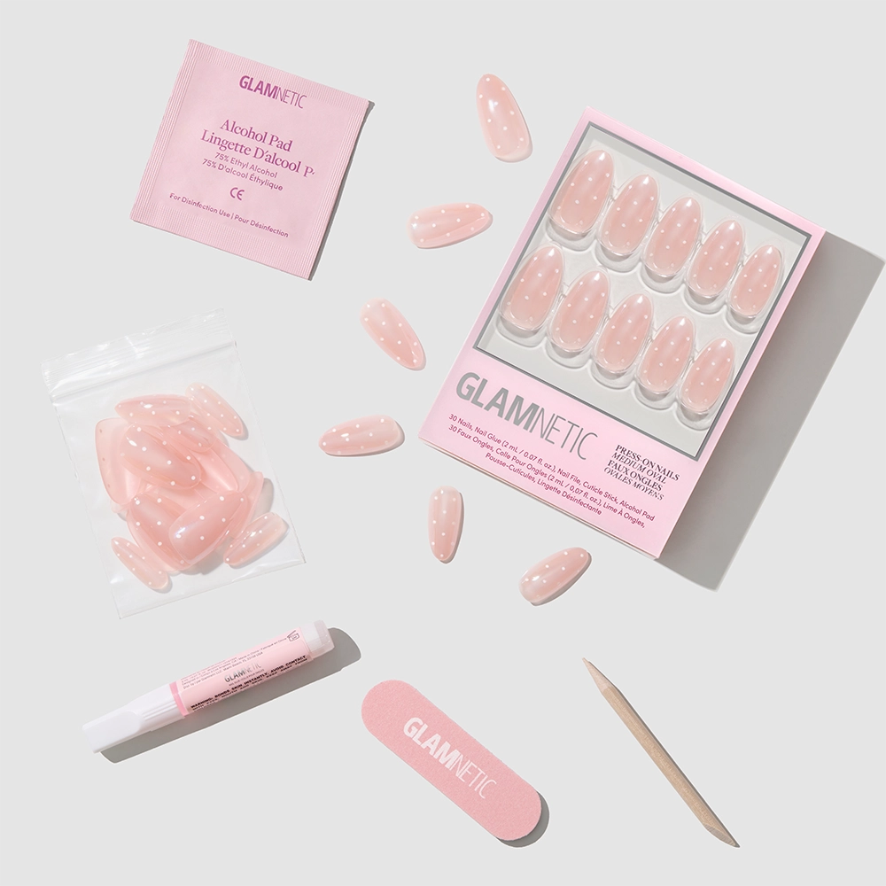 Glamnetic press-on nails with packaging and application tools on a light gray background - Product image