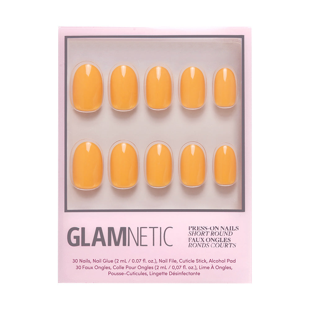 Sunset Orange by glamnetic is a set of citrusy yellow short round press-on nails. Each box includes 30 nails, nail glue, adhesive tabs, a cuticle stick, and an alcohol pad for easy summer style. - Product image