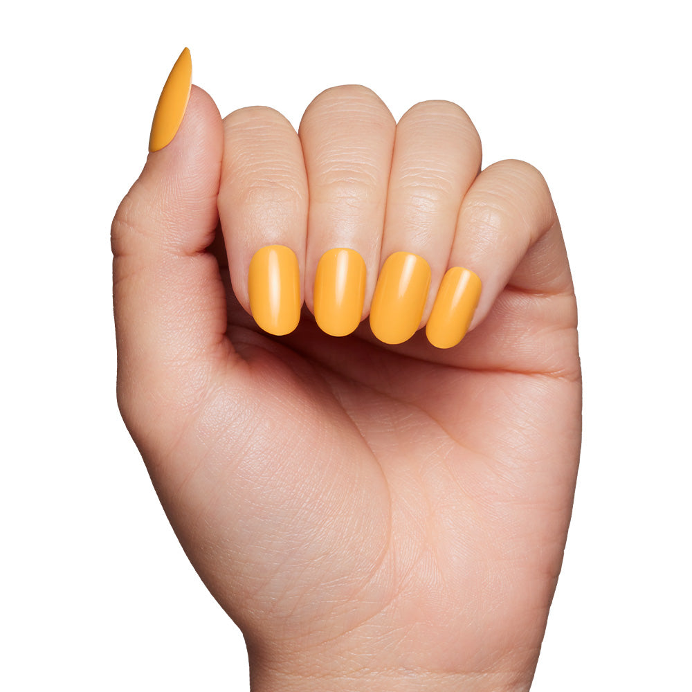 A hand with neatly manicured nails painted in glamnetic’s Sunset Orange pops against a white background—ideal for making a bold, citrus-inspired statement. - Product image