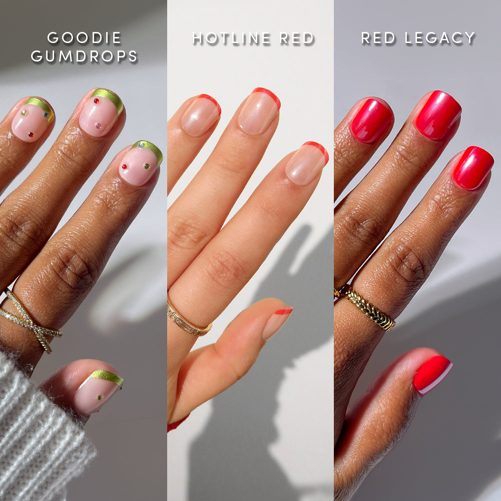 Three hands display different nail designs: pink with green and gold tips, nude with red tips, and bright red polish. Each hand is adorned with gold rings and labeled as Goodie Gumdrops, Hotline Red, and Red Legacy. glamnetic’s Super Short Stop natural-looking press-on nails deliver salon-quality manis in ultra chic super short styles for an effortlessly stylish look.