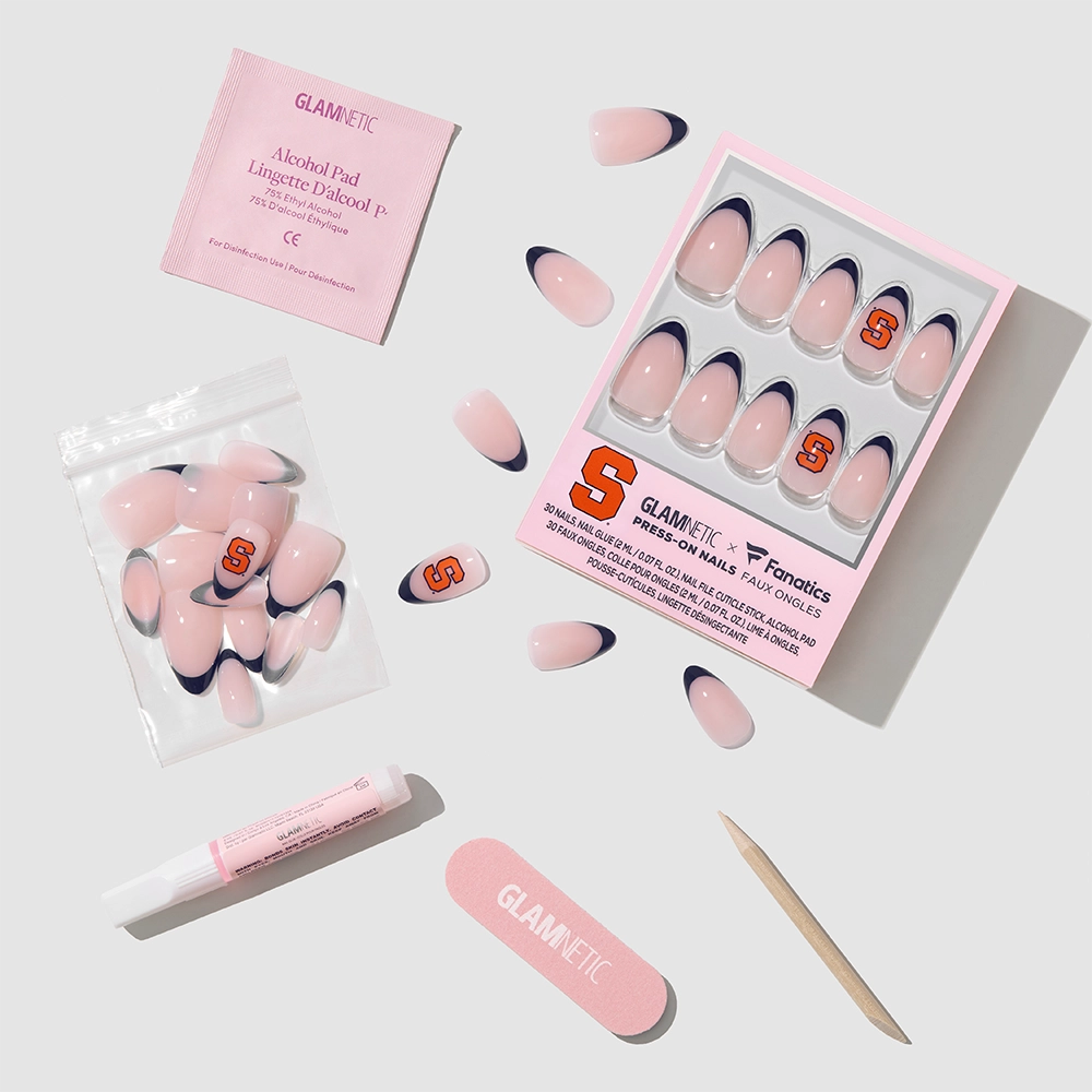 The glamnetic Syracuse Orange Press-On Nail Set includes pink nails with navy tips and an orange S logo, plus an alcohol pad, glue, nail file, cuticle stick, and extra nails—ideal for a stylish game day look. - Product image