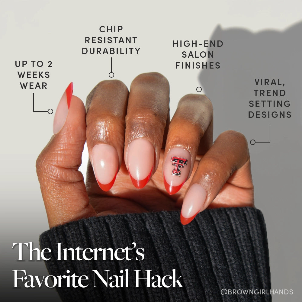 A hand displays the glamnetic Texas Tech Red Raiders Press-On Nail Set with red-tipped French nails and team logo accents. Benefits featured include long wear, chip resistance, a high-end finish, and trendy school spirit. - Product image