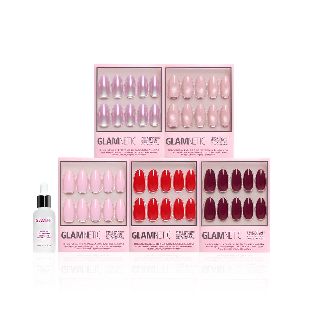 Six boxes of glamnetic The Medium Oval Edit press-on nails in pink, red, and purple are arranged in two rows, with a glamnetic cuticle oil bottle placed in front, all set against a white background. - Product image