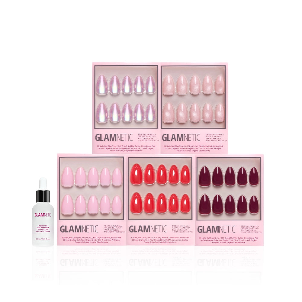 Five boxes of glamnetic's The Short Almond Edit press-on nails, in shades of pink, red, and burgundy, are arranged in two rows with a bottle of Glamnetic nail glue placed in front on a white background. - Product image