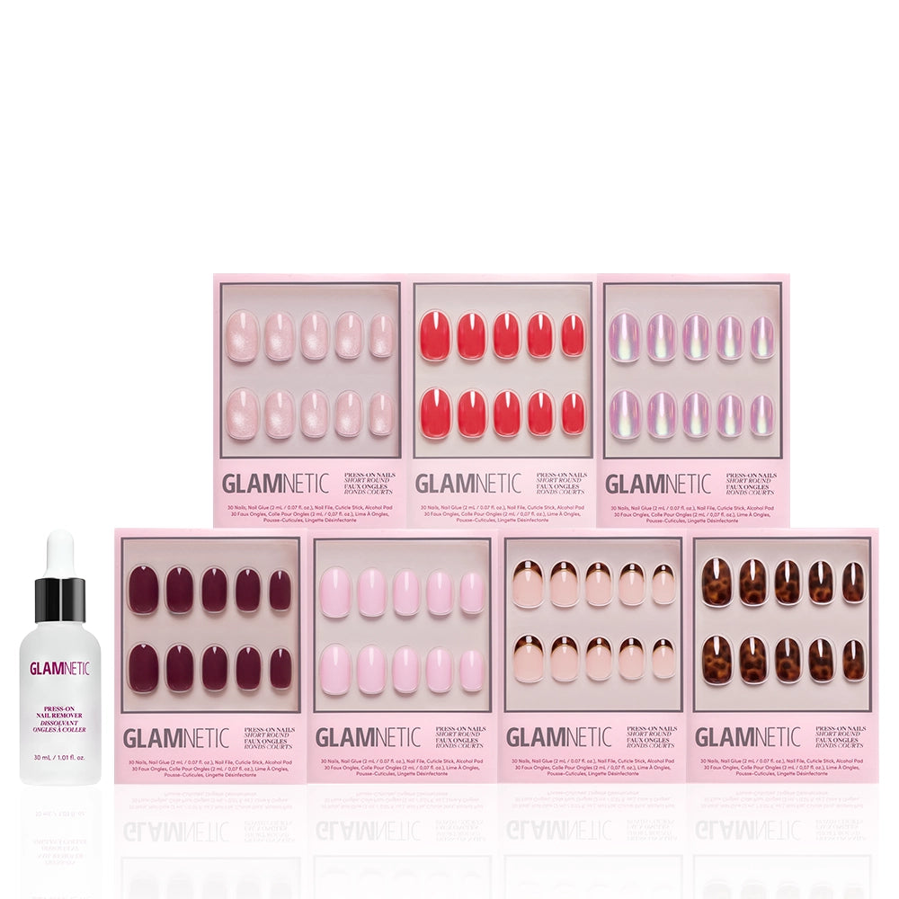 Nine boxes of glamnetic’s The Short Round Edit press-on nails are arranged in two rows, with a cuticle oil bottle to the left, all set against a white background to showcase this stylish mani collection. - Product image