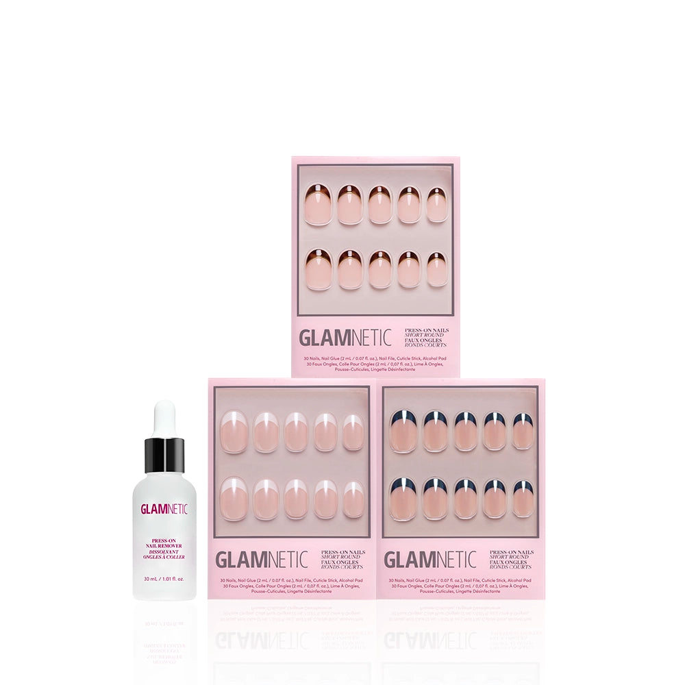 Three boxes of glamnetic The Short Round Frenchies press-on nails in light pink packaging are arranged above a small bottle of glamnetic cuticle oil with a dropper cap, all set against a white background. - Product image