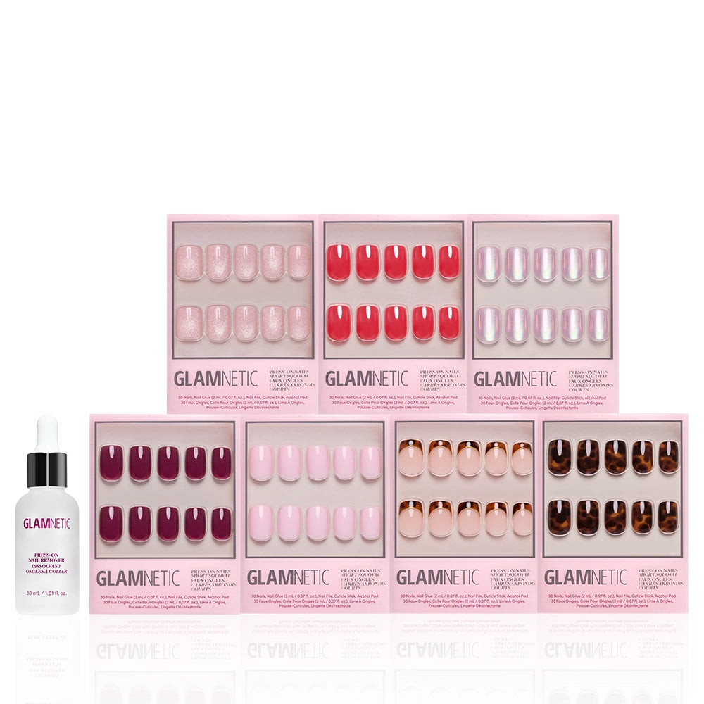 Eight boxes of glamnetic’s The Short Squoval Edit press-on nails in assorted colors and styles are arranged in rows as a vibrant bundle, with a small bottle of nail glue placed in front on a white background. - Product image