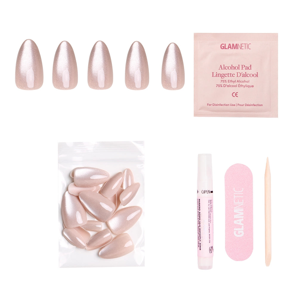 The Vow by glamnetic: Pink velvet-gloss almond nails set with alcohol pad, extra nails, nail glue, pink file, and wooden cuticle stick, all arranged on a white background. - Product image