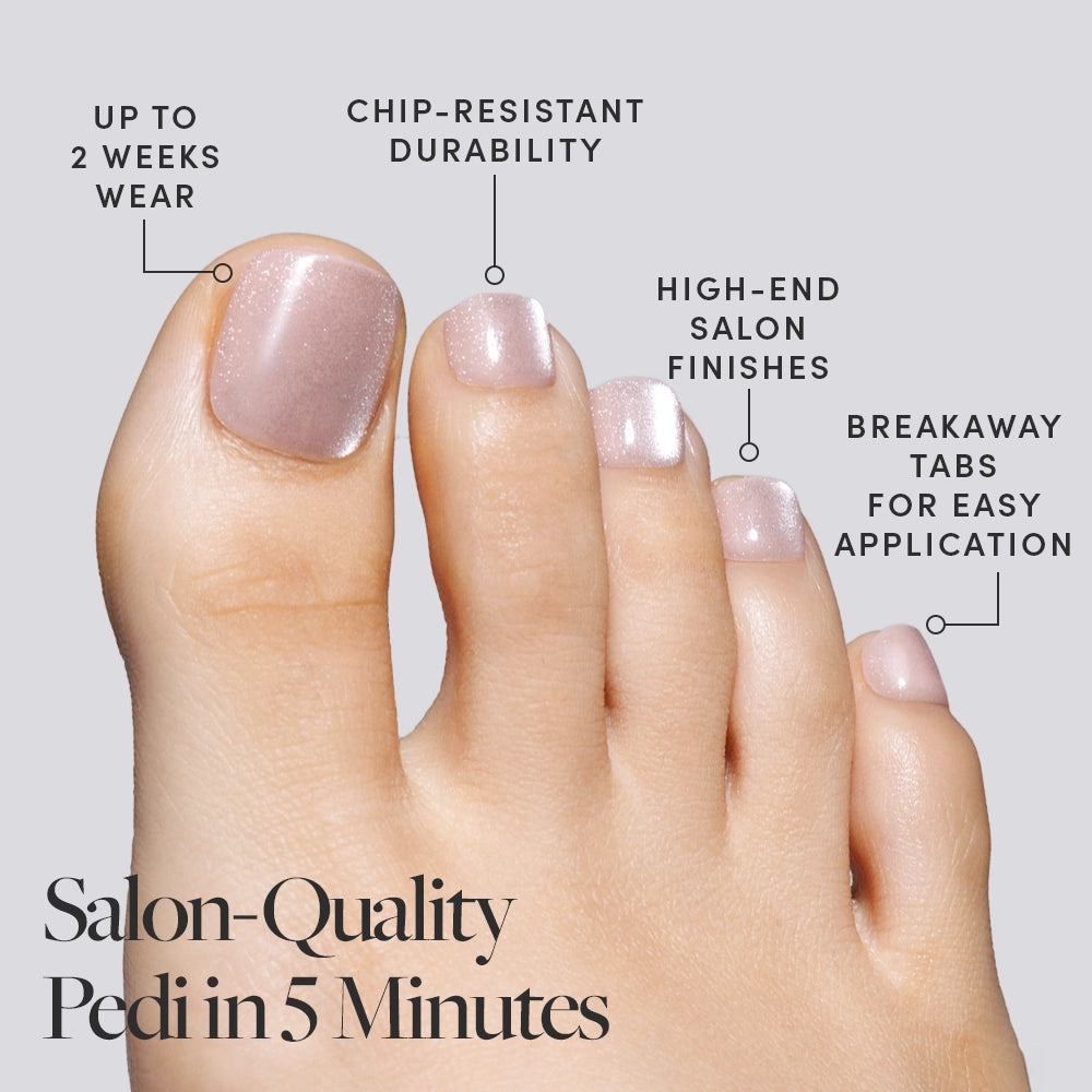 A foot wearing shimmer nude pink Glamnetic press-on toenails, labeled with features like chip-resistance and salon-quality finish. - Product image