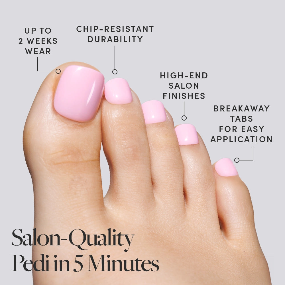 A foot with glossy pastel pink Glamnetic press-on toenails, highlighting fast application and long-lasting wear. - Product image