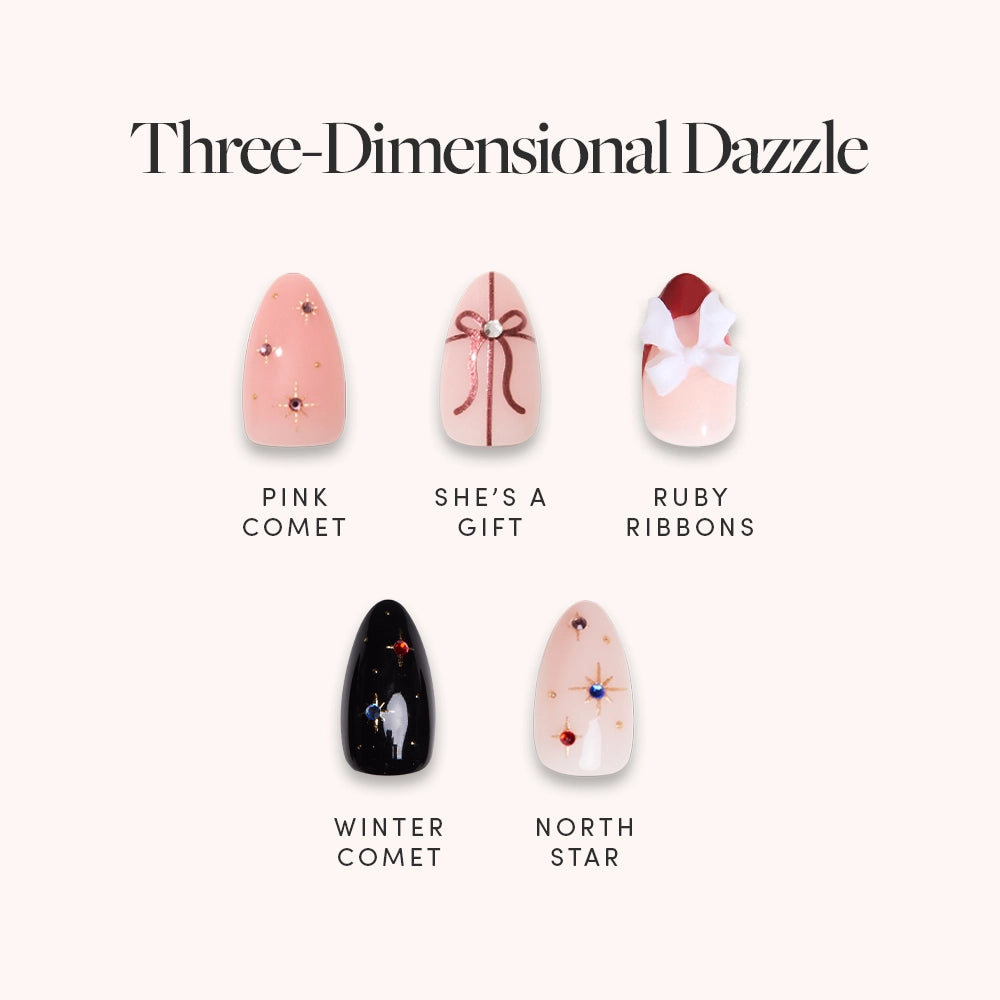 Glamnetic’s Three-Dimensional Dazzle features five holiday almond nail designs: pink with comets, nude with a bow, red and white ribbons, black with stars, and nude with colorful stars—all finished with stunning 3D nail gems.