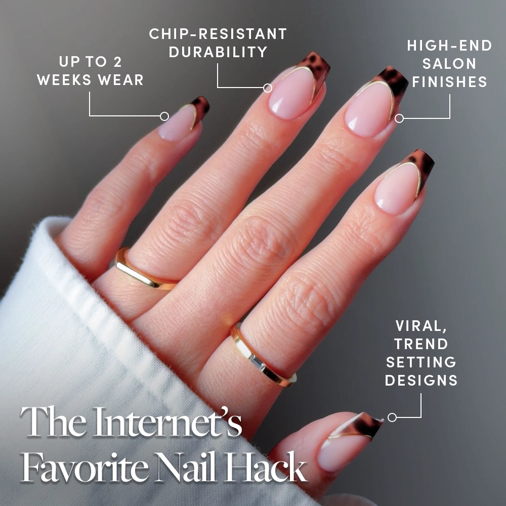 A hand with glossy, almond-shaped glamnetic Top Tier press-on nails featuring brown tortoiseshell French tips; text highlights up to 2 weeks wear, chip-resistant durability, high-end salon finish, viral trendy design. Gold rings on two fingers. - Product image