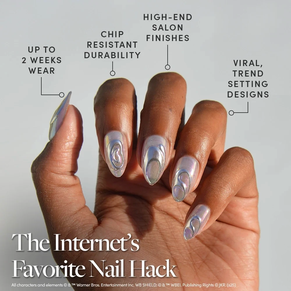 A hand showcasing almond-shaped iridescent Unicorn Blood press-on nails by Glamnetic with silver 3D accents, with text callouts highlighting their durability, chrome finish, and design quality. - Product image