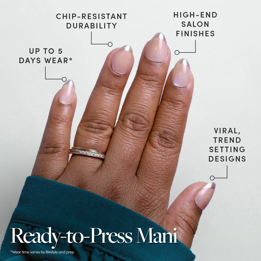 A hand with neatly manicured, nude-colored glamnetic Velvet Chrome Press On Nails with a silver tip and a diamond ring. Enjoy chip-resistant durability, up to 5 days of wear, high-end salon finish, and trendy designs. - Product image