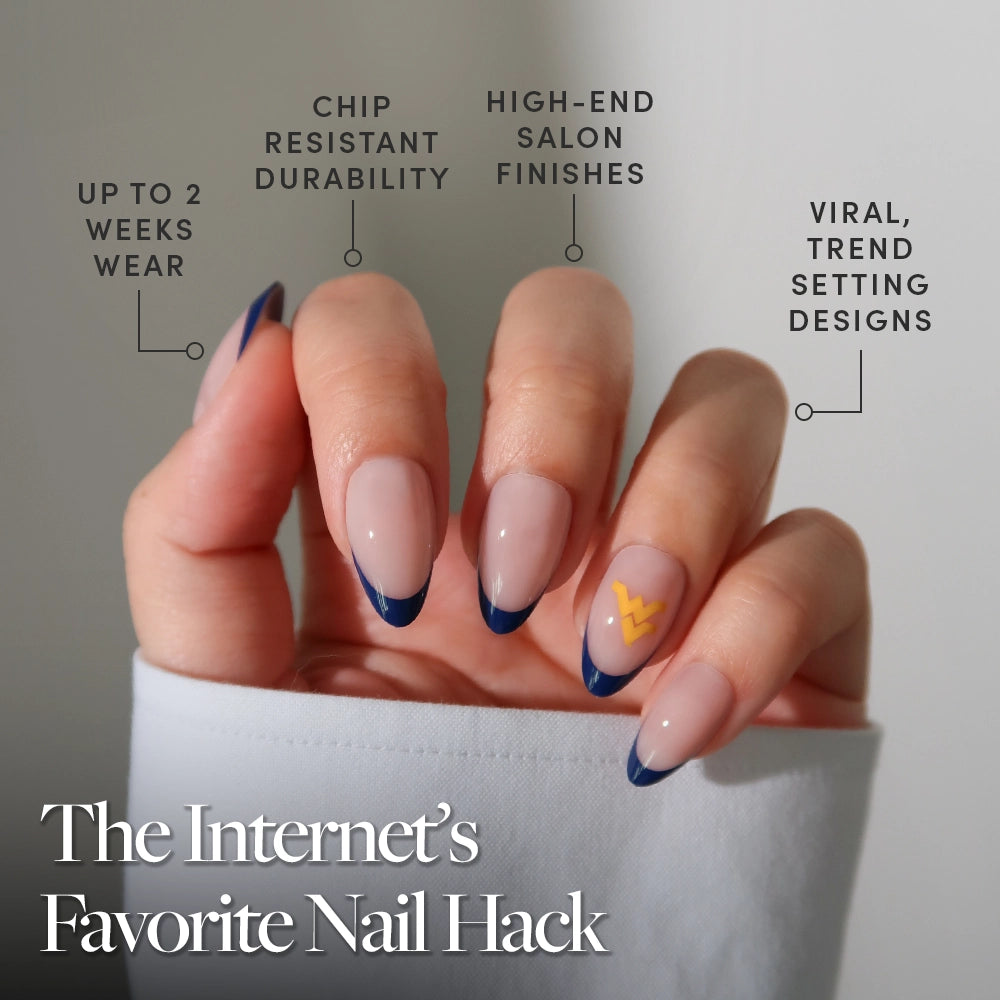 The West Virginia Mountaineers Press-On Nail Set by glamnetic showcases a nude base, dark blue French tips, and yellow zigzag accents for salon-quality, trendy nails that last up to 2 weeks. - Product image