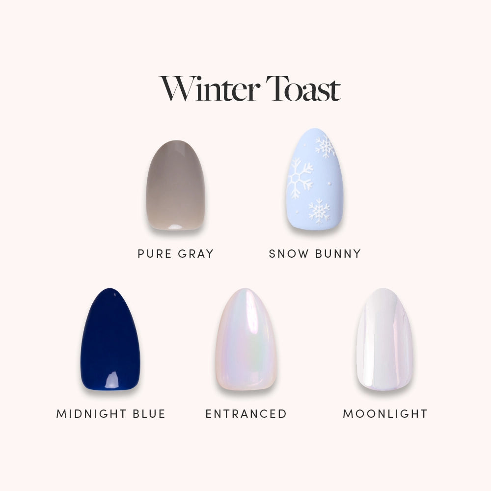 Five glamnetic Winter Toast Bundle nail polish swatches: pure gray (taupe), snow bunny (white with snowflake design), midnight blue, entranced (iridescent pink), and moonlight (pearl white)—a cool-toned winter set.