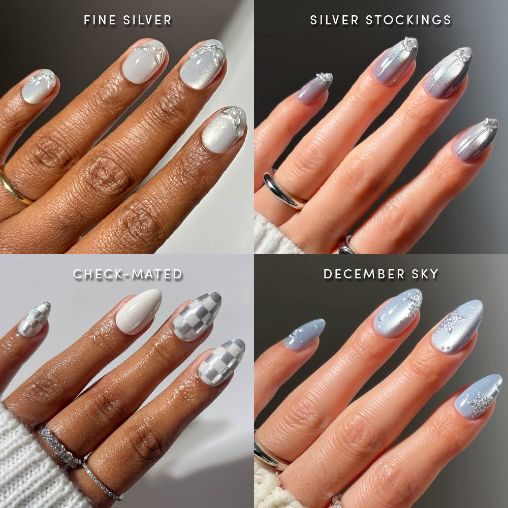 Four hands display glamnetic’s Winter Village nail bundle of striking salon-quality manicures: pearly silver, gray ombre tips, white-gray checkerboard, and blue with glitter. Each look is labeled: Fine Silver, Silver Stockings, Check-Mated, December Sky—perfect press-on nails for a stunning seasonal statement.