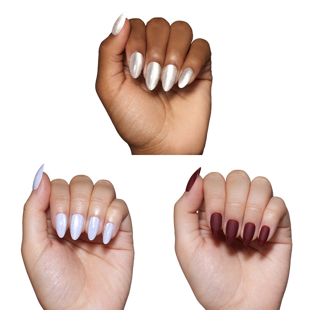 Three hands flaunt Winter Wonderglam press-ons by glamnetic: shimmery champagne nails on top, pearlescent blue cats-eye on the left, and matte burgundy on the right—all in a flawless almond shape. - Product image