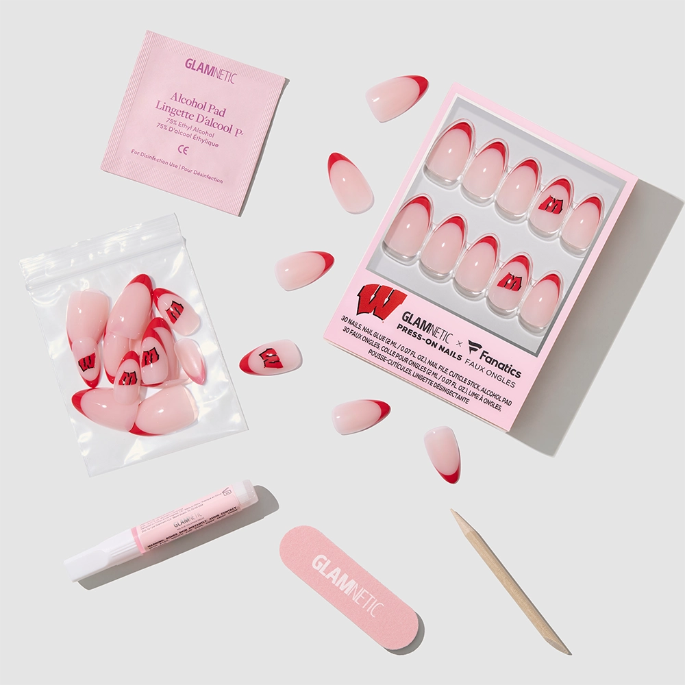 The glamnetic Wisconsin Badgers Press-On Nail Set features short almond nails with red tips and a W logo. Includes nail file, cuticle stick, glue, alcohol pad, and extra nails—all displayed on a white background. - Product image