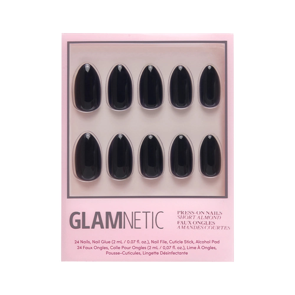 A box of glamnetic Boba black press-on nails in a short almond shape, featuring ten glossy, vegan, cruelty-free nails arranged neatly in two rows on a pink background. - Product image