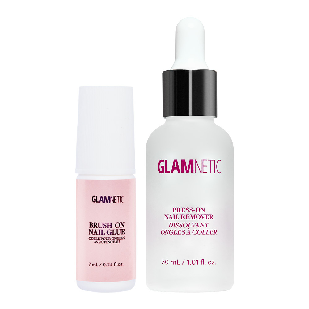 Glamnetic’s Press & Perfect duo: a small pink bottle of press-on nail glue and a larger clear bottle of press-on nail remover with a white dropper cap, both upright on a white background—your essential pair for the perfect press-on manicure.