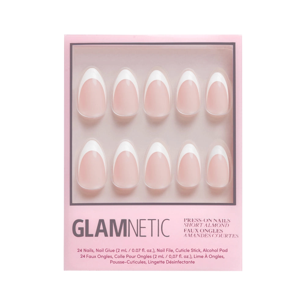 A box of glamnetic Ma Damn cruelty-free press-on nails in a short almond shape and light pink color. Includes 24 nail tips, glue, file, cuticle stick, and alcohol pad, all packaged in stylish pink. - Product image