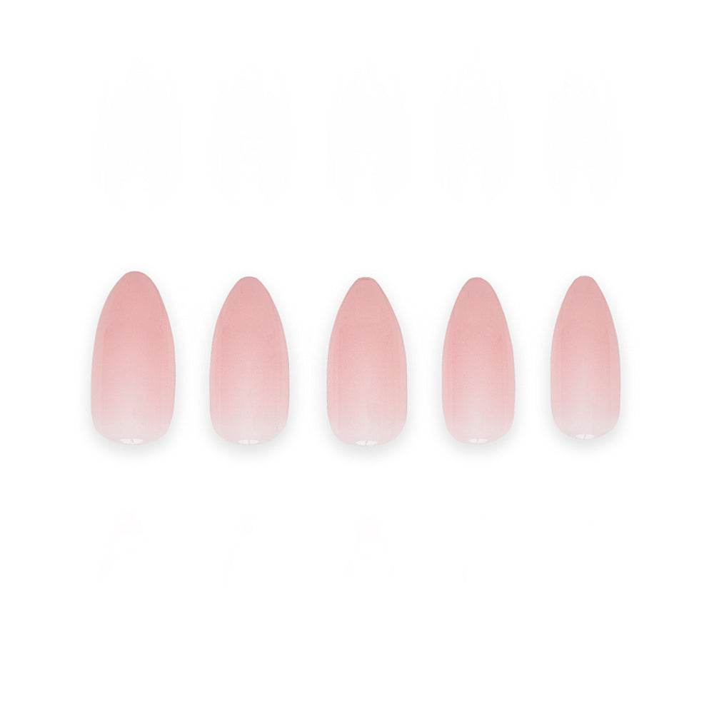 Five Cloud 9 press-on nails by glamnetic are arranged in a row, each with a glossy light pink finish and pointed almond shape, set against a plain white background. - Product image