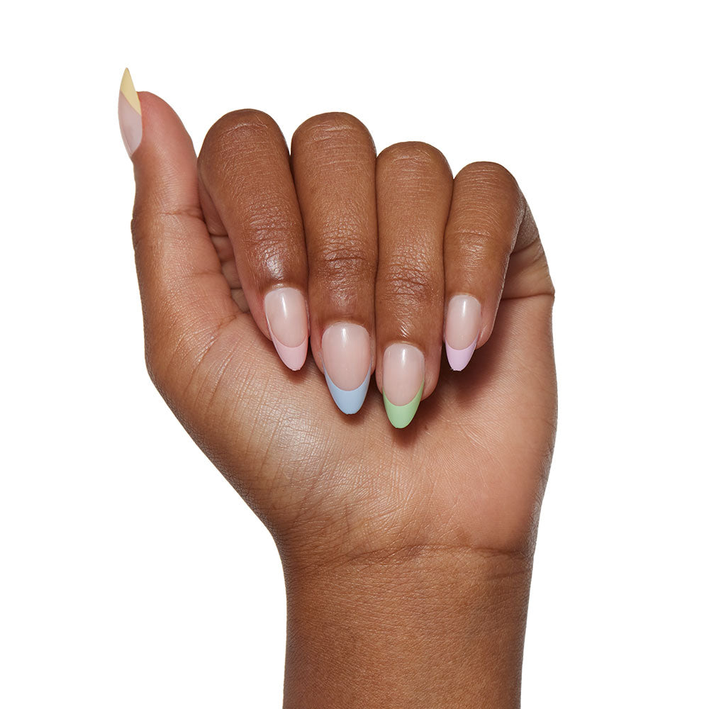 A hand with almond-shaped nails wears glamnetics Confetti set: a French manicure with pastel tips—yellow (thumb), pink (index), blue (middle), green (ring), and lavender (pinky). - Product image