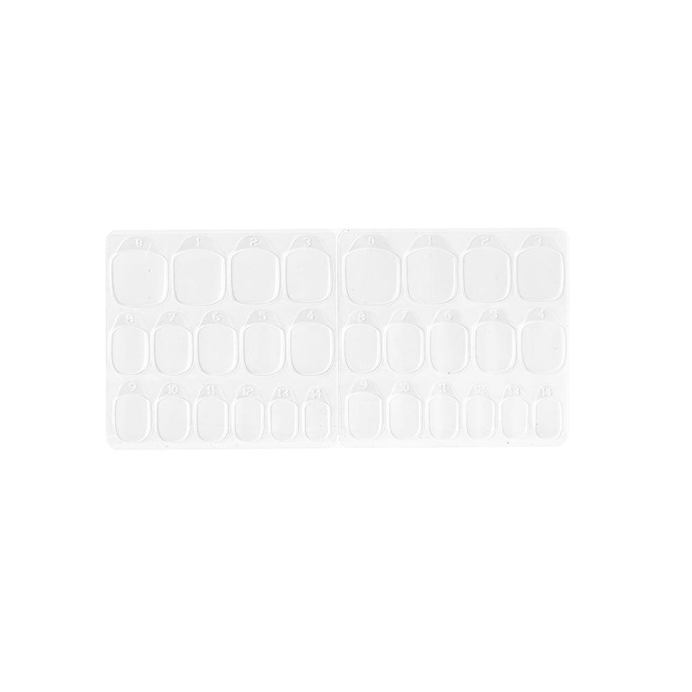 The glamnetic Adhesive Nail Tabs are shown in a clear plastic tray with multiple rows of empty oval and rectangular compartments, ideal for organizing your nail tabs or artificial nails at home. Displayed on a white background. - Product image