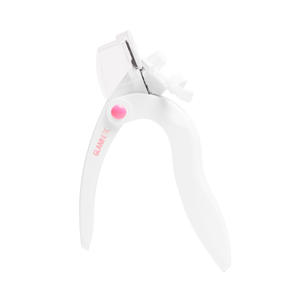 The glamnetic Snip & Shape is a white eyelash applicator with a pink button and clear guard, perfect for applying or trimming false lashes—pairs perfectly with your favorite stainless steel nail tool. - Product image