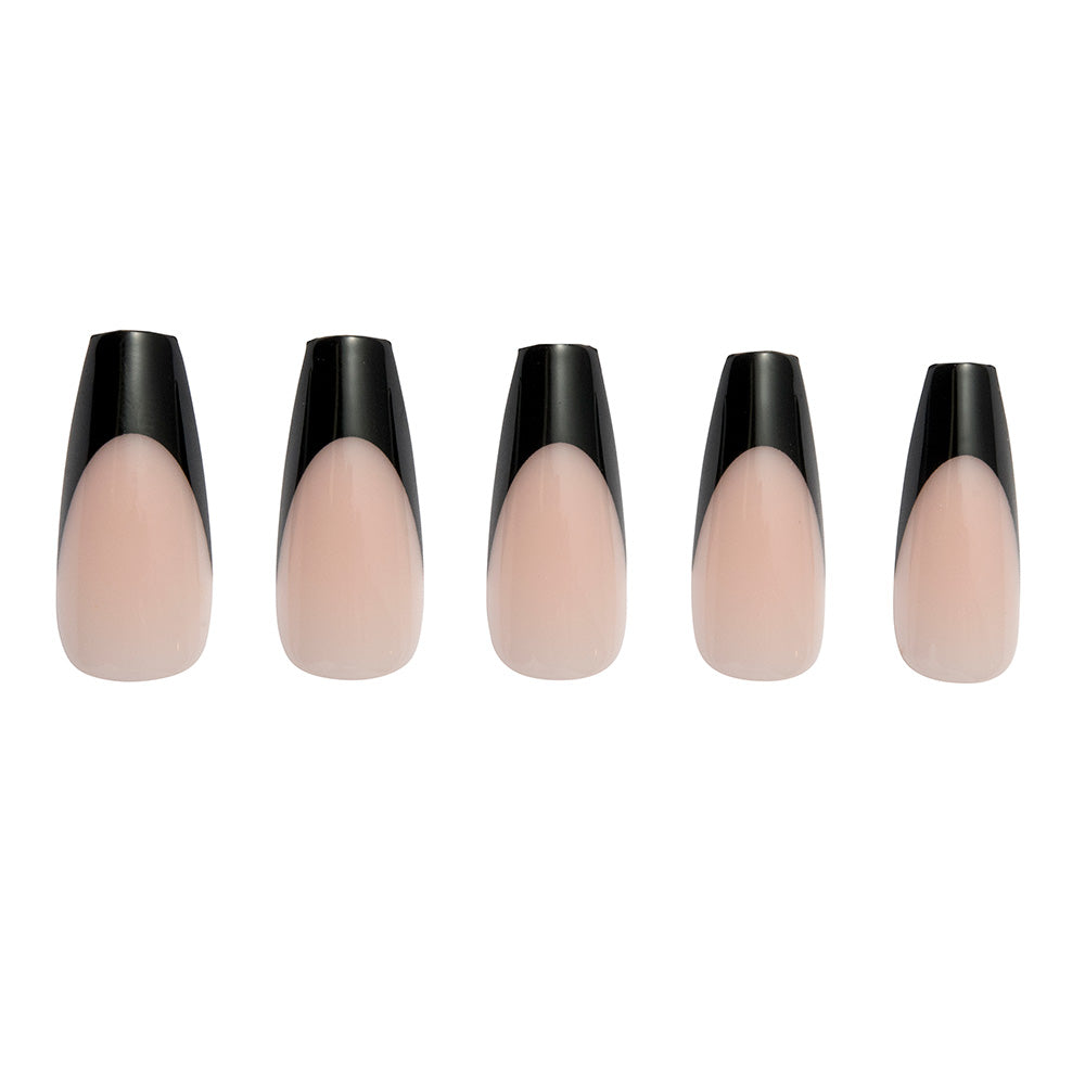 Five coffin-shaped nails from glamnetic’s Rogue set feature a nude base with glossy black French tips, arranged in a row against a white background. These stylish nails are vegan and cruelty-free. - Product image