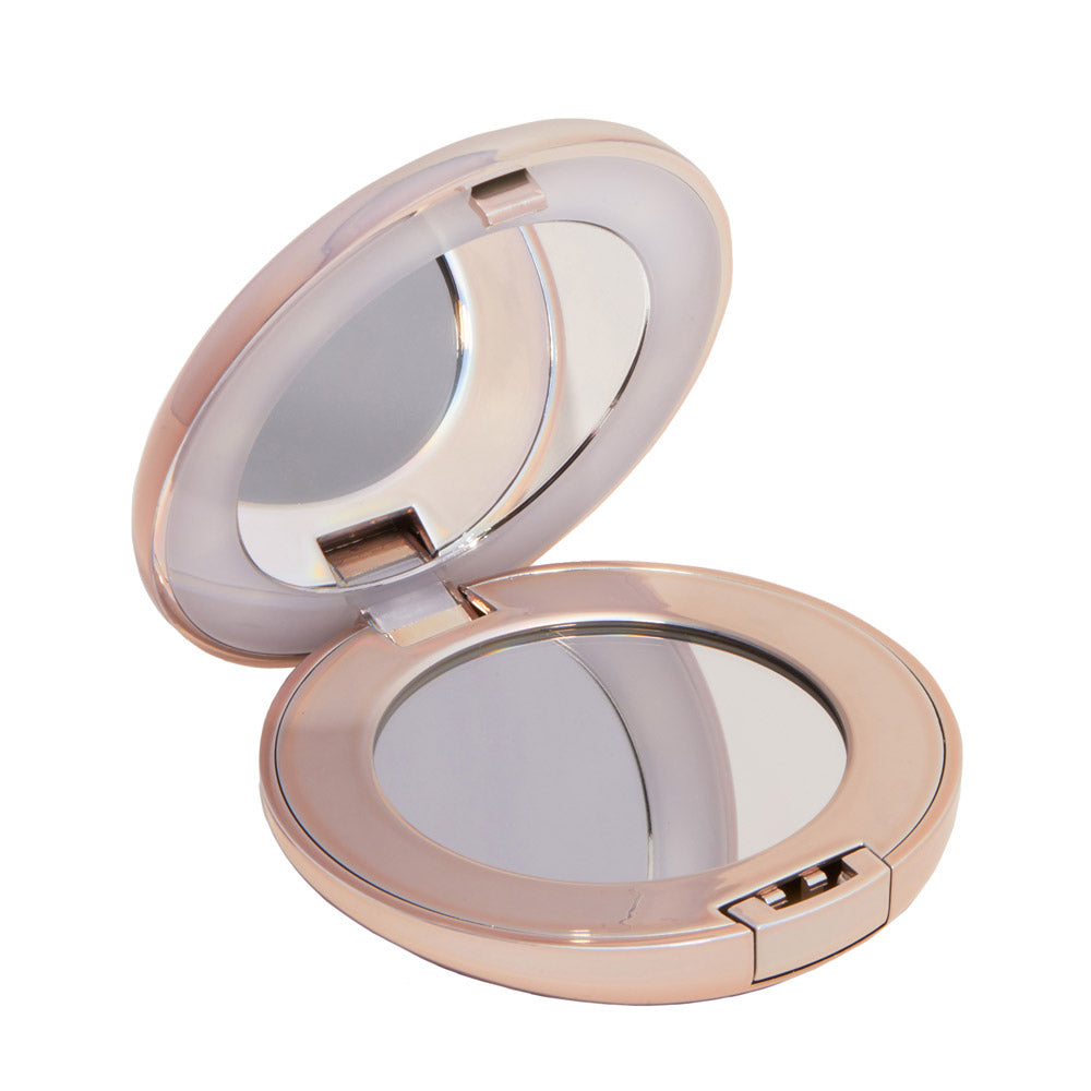 The glamnetic Compact Mirror features a round, pink glossy case with a hinged lid, front latch, and opens to reveal two mirrors—one standard and one magnifying. - Product image