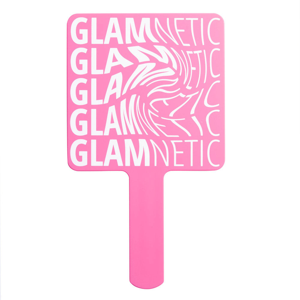The glamnetic Handheld Mirror is pink with “glamnetic” repeated four times in white, featuring a wavy, distorted letter design—ideal as a compact mirror for precise lash application. - Product image