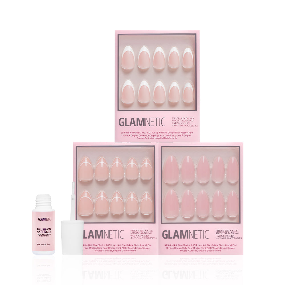Three boxes of glamnetic press-on nails, including Ma Damn, Heavenly Cloud 9, and Simple & Clean, are stacked in soft pink shades with a Nail Glue bottle beside them against a white background. Perfect add ons for your nail routine. - Product image