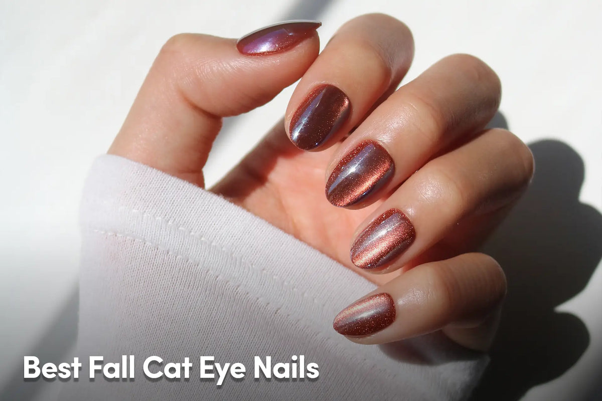 Hand with metallic brown cat-eye nails