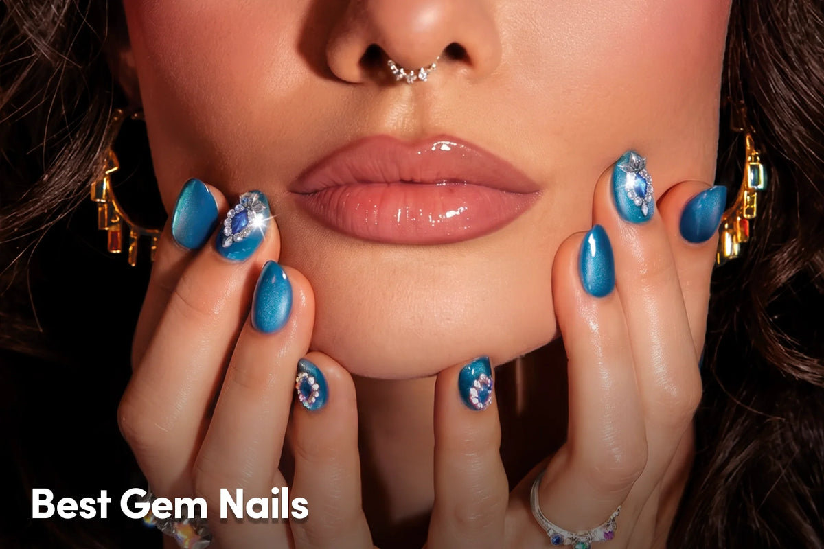 Blue gem nails with sparkling rhinestone accents.