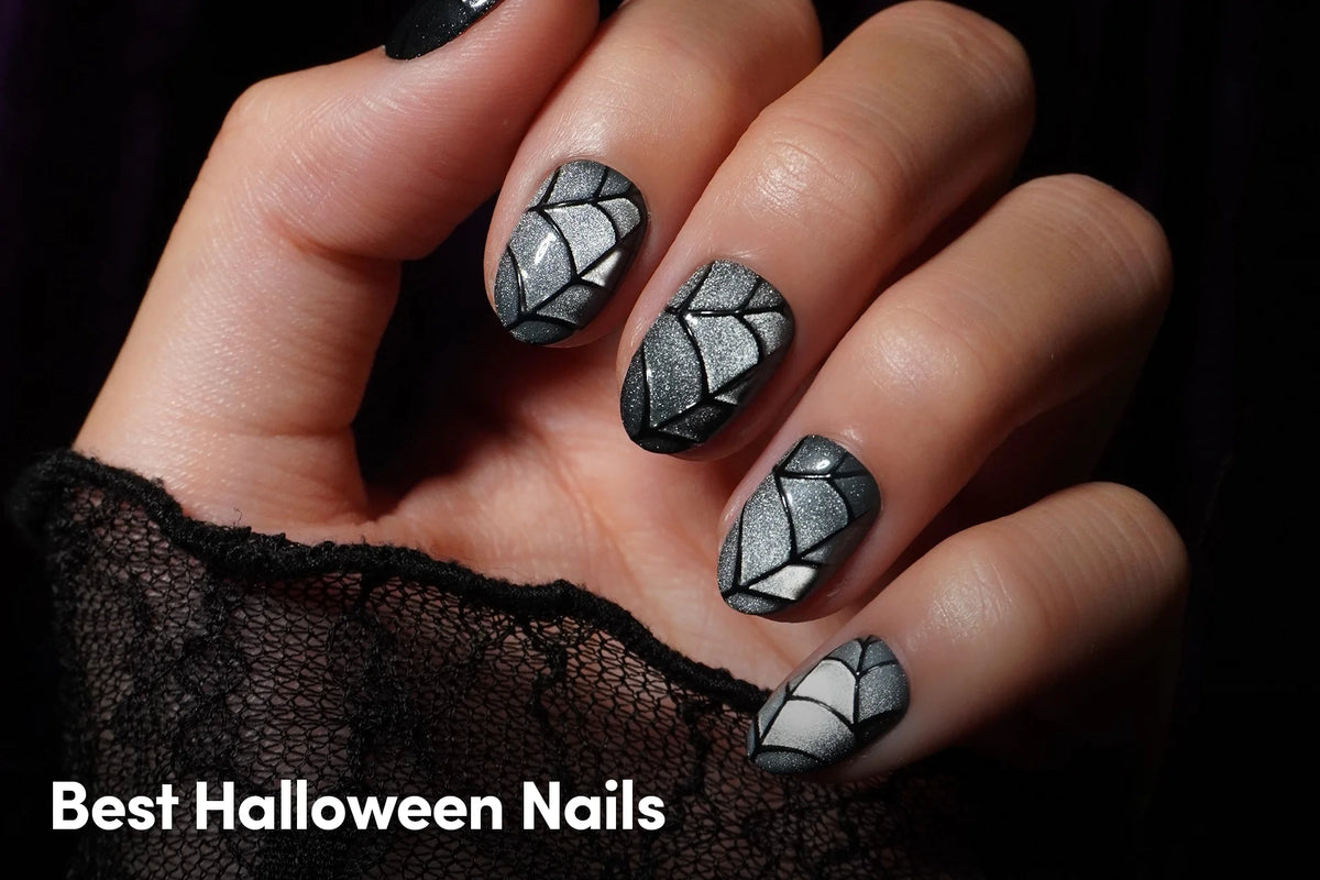 Black and silver geometric Halloween nails.
