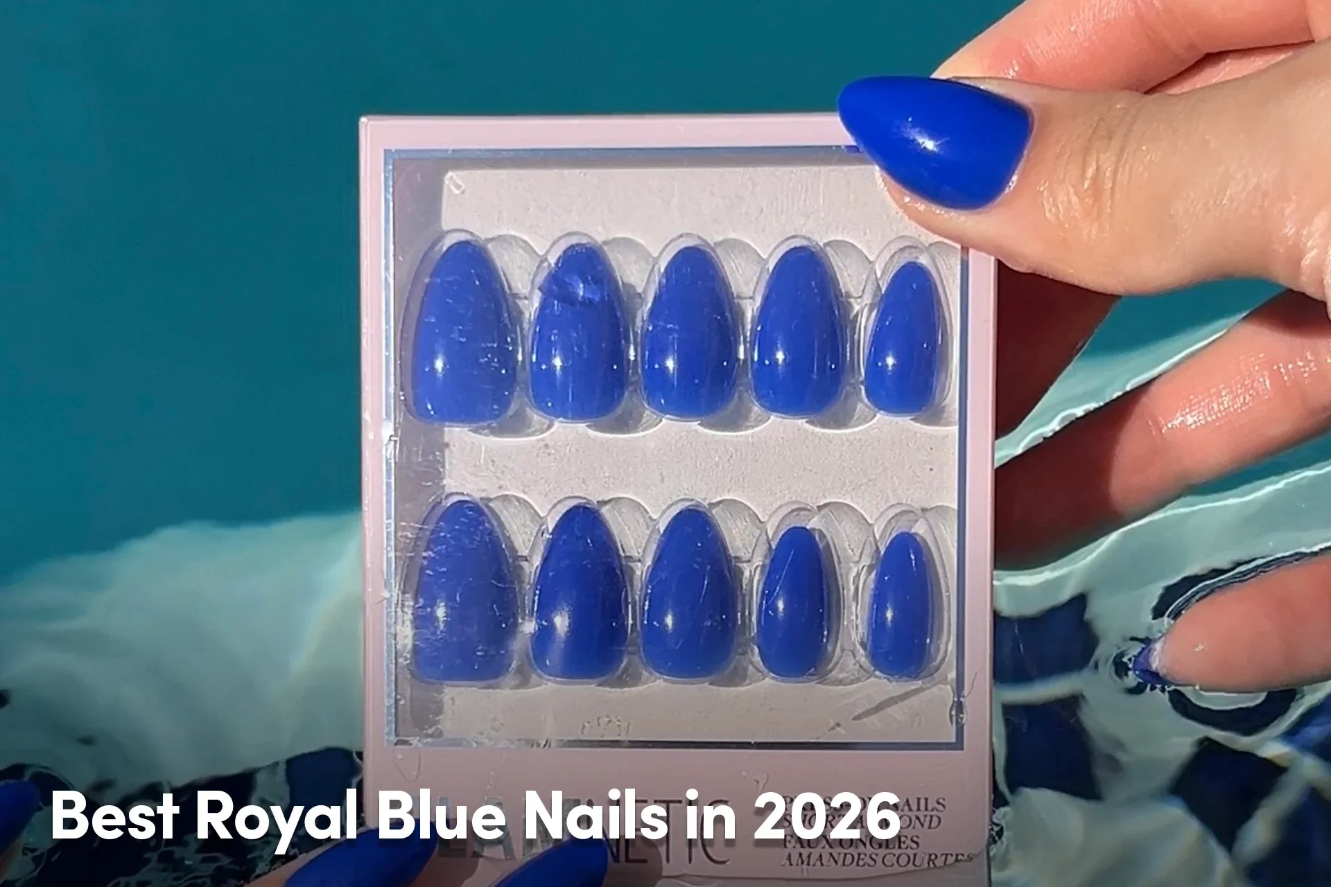 Royal blue almond-shaped press-on nails displayed in a case.