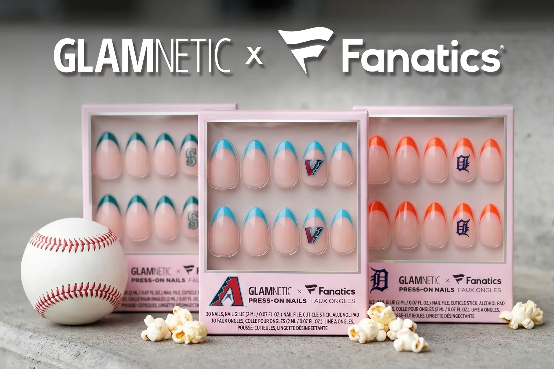 Glamnetic x Fanatics press-on nail kits with team logos displayed alongside a baseball and popcorn.
