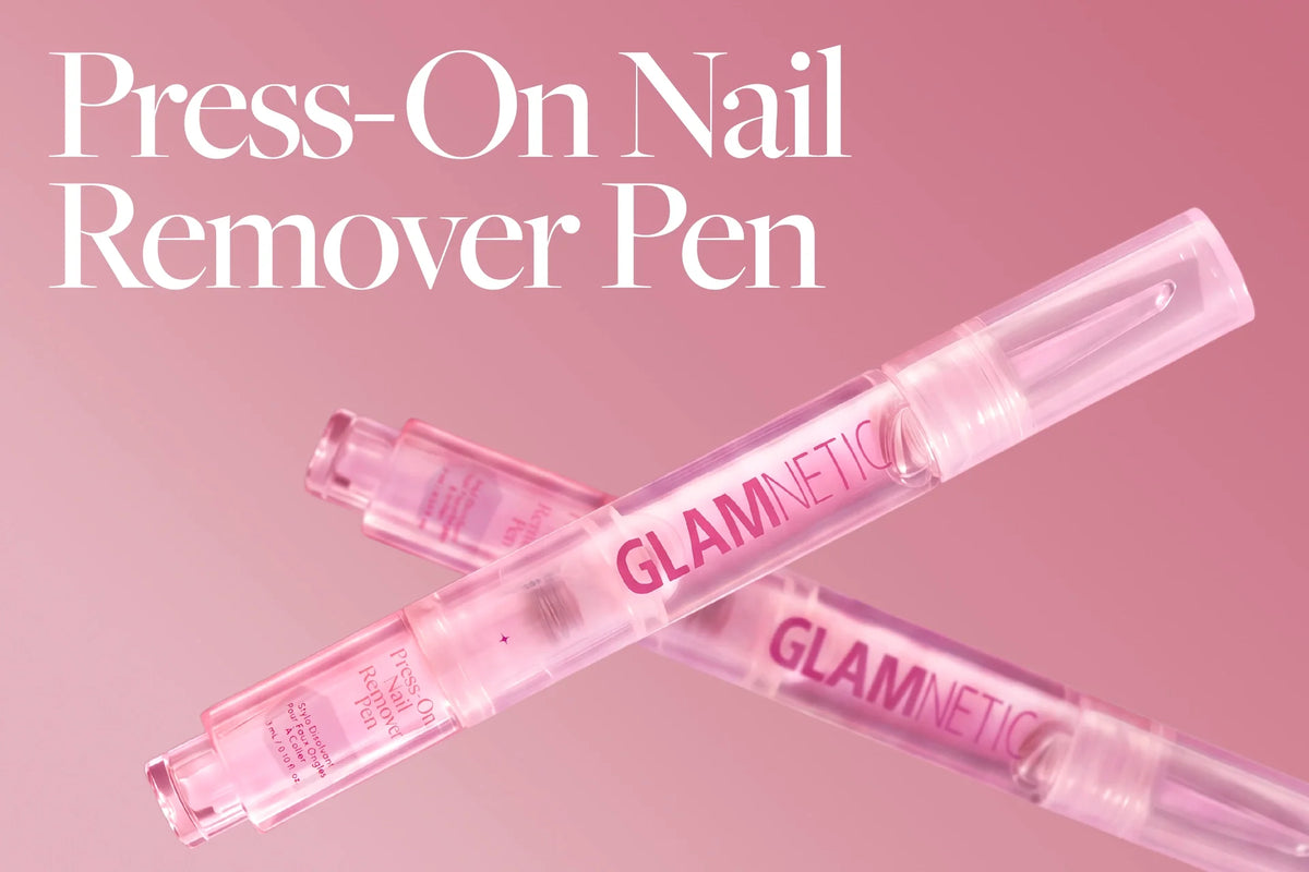 Two Glamnetic Press-On Nail Remover Pens crossed against a pink background.