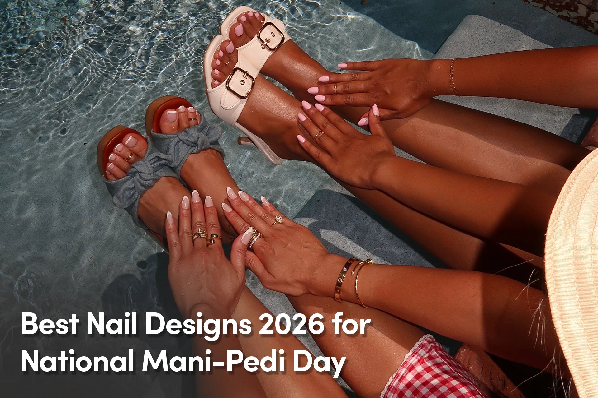 Friends showing matching pink manicures and pedicures by a pool