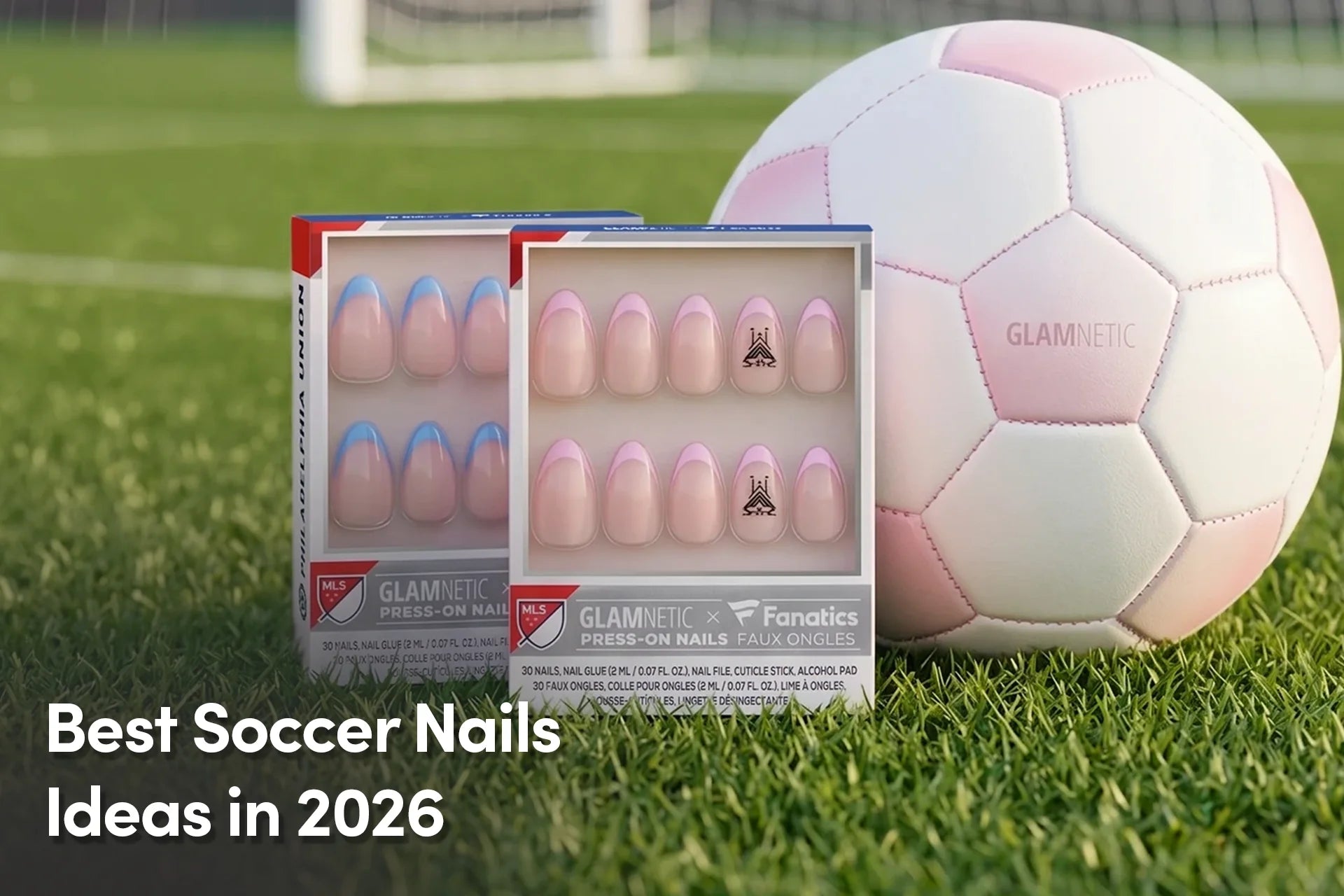 Glamnetic soccer-themed press-on nails displayed on a soccer field beside a pink-and-white soccer ball.